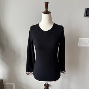 Stretchy black three-quarter check cuffed sleeve top